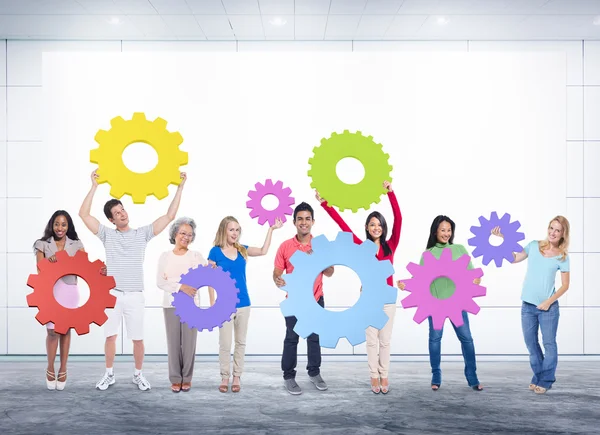 Diversity People holding Gears — Stock Photo, Image