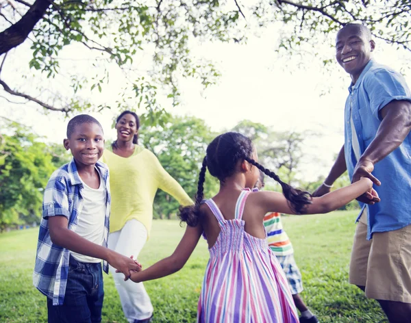 Happy African family in the park — Stock Photo, Image