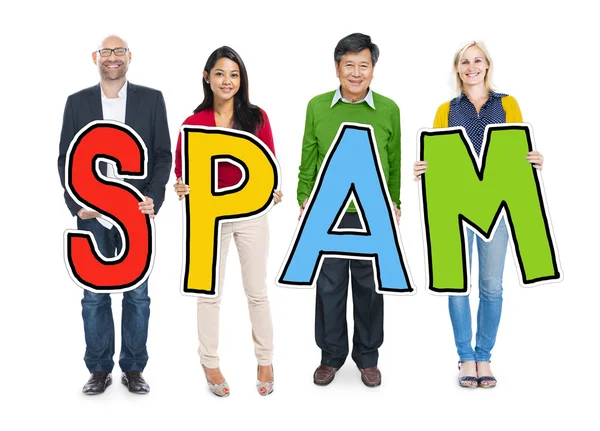 Gente diversa sosteniendo el Spam del texto —  Fotos de Stock