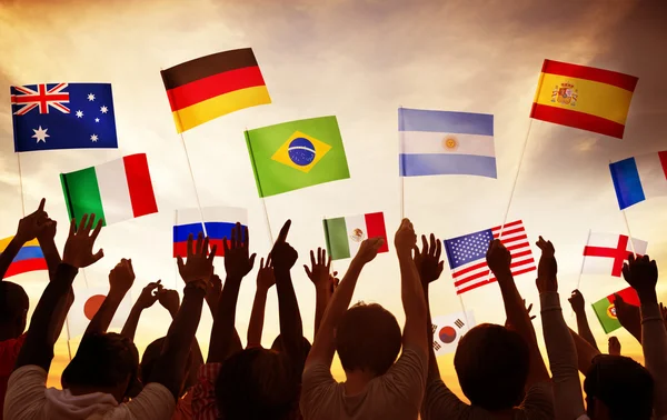 Group of People Waving National Flags