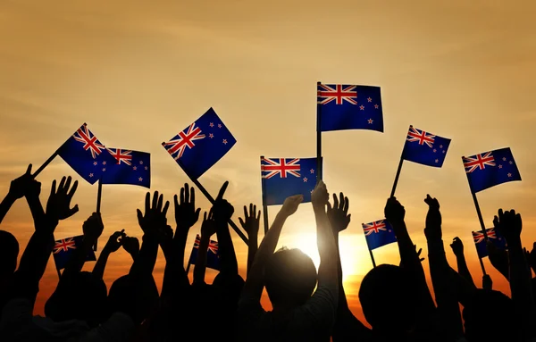 Group of People Waving Flags of New Zealand — Stock Photo, Image