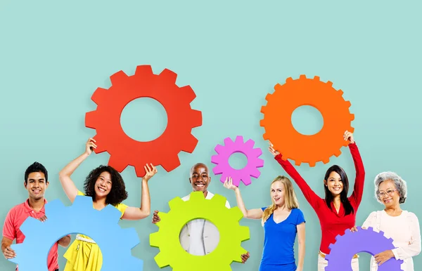 Diversity People holding Gears — Stock Photo, Image