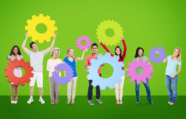 Diversity People holding Gears — Stock Photo, Image