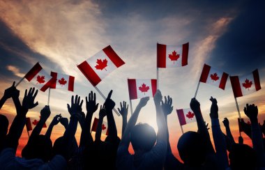 Group of People Waving Canadian Flags clipart