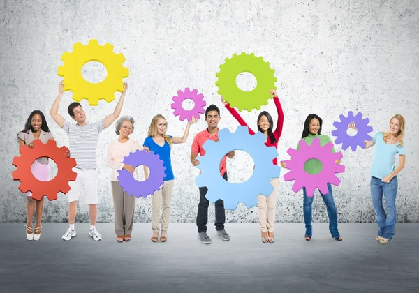 Diversity People holding Gears — Stock Photo, Image