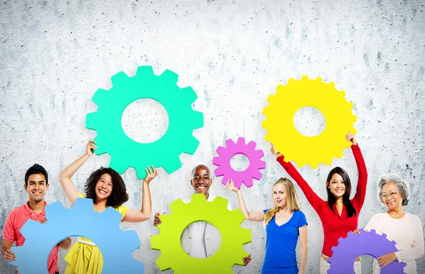 Diversity People holding Gears — Stock Photo, Image