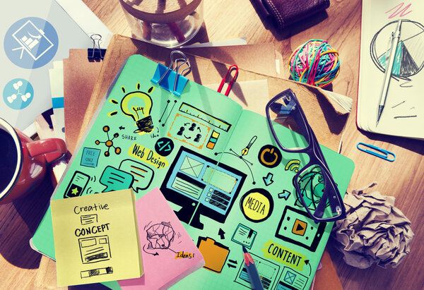 Messy office desk with Web Design