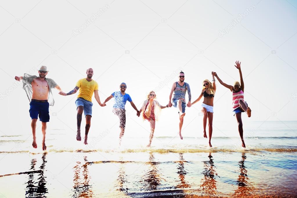 happy friends having fun on the beach