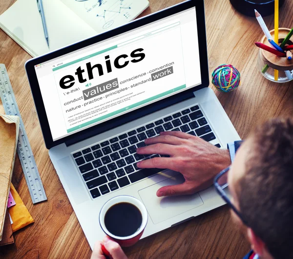 Man Reading the Definition of Ethics — Stock Photo, Image