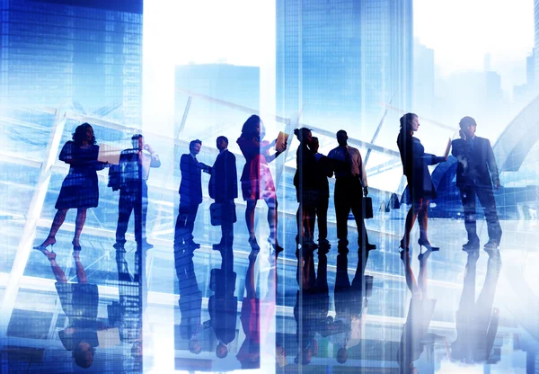 Silhouettes of business people — Stock Photo, Image