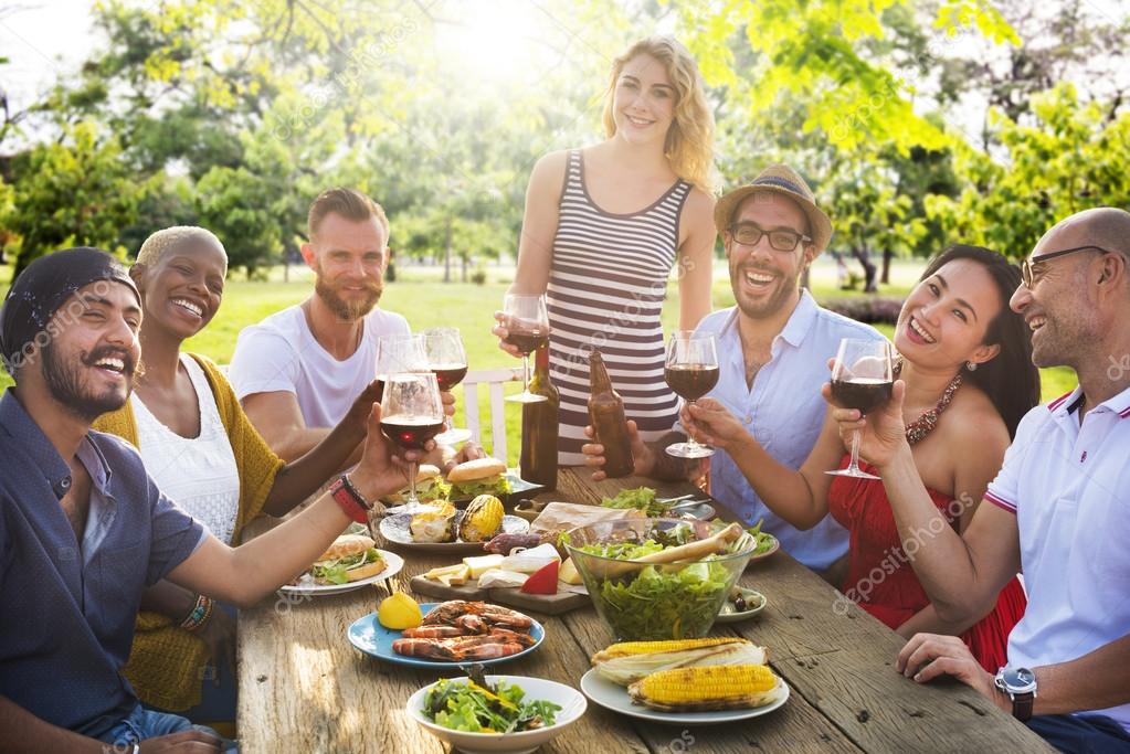 Friends hanging out, enjoying picnic - Stock Image - F020/2364 - Science  Photo Library