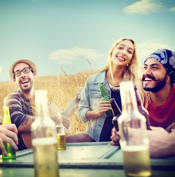 Friends hanging out at outdoors party — Stock Photo, Image