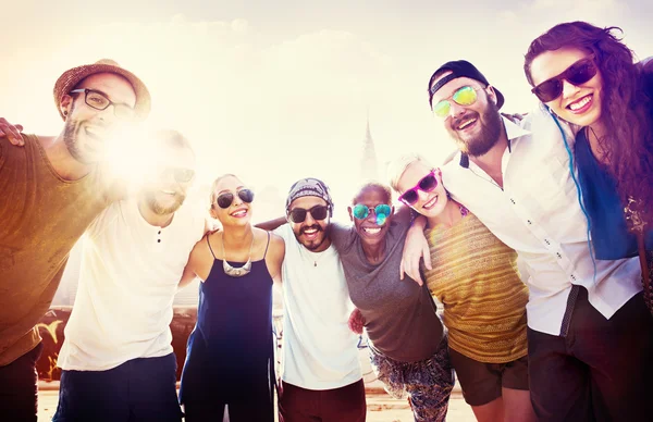 Friends in sunglasses standing together at outdoors — Stock Photo, Image