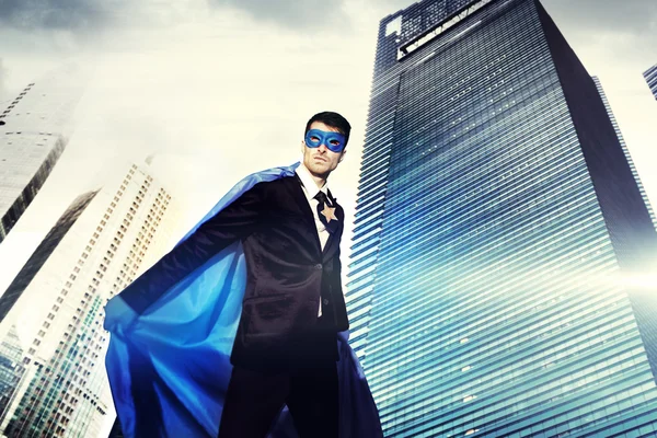 Superhero Businessman in modern city — Stock Photo, Image