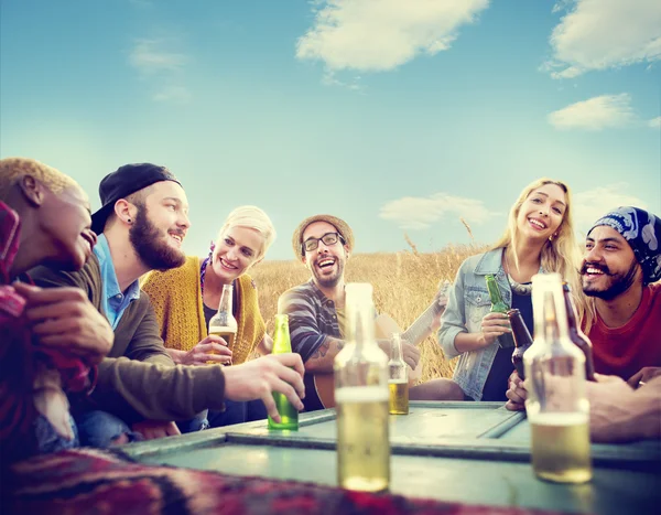 Friends hanging out at outdoors party — Stock Photo, Image