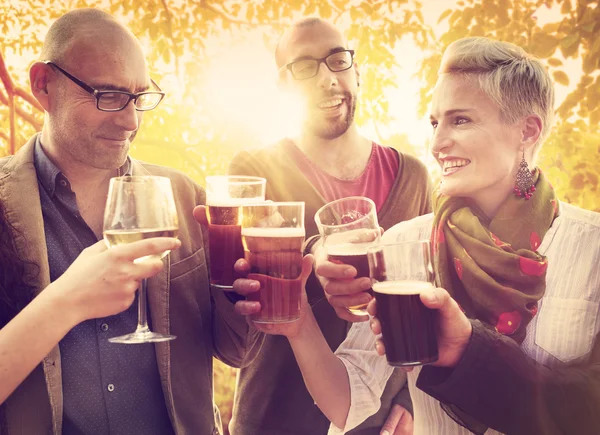 Diverse cheerful friends hanging out at outdoors party — Stock Photo, Image