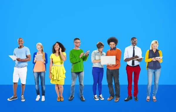 People standing together with digital devices — Stock Photo, Image