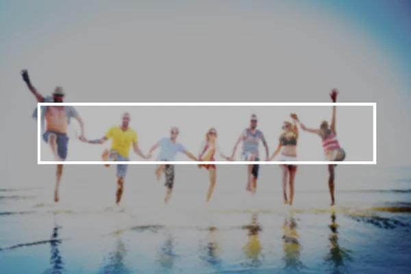 Happy friends jumping on the beach — Stock Photo, Image