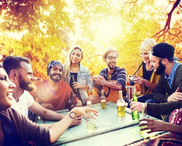 Diverse cheerful friends hanging out at outdoors party — Stock Photo, Image