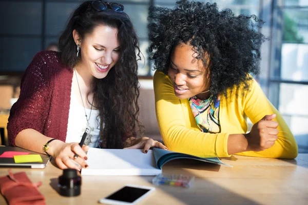 Female students studying in classroom — Stock Photo, Image