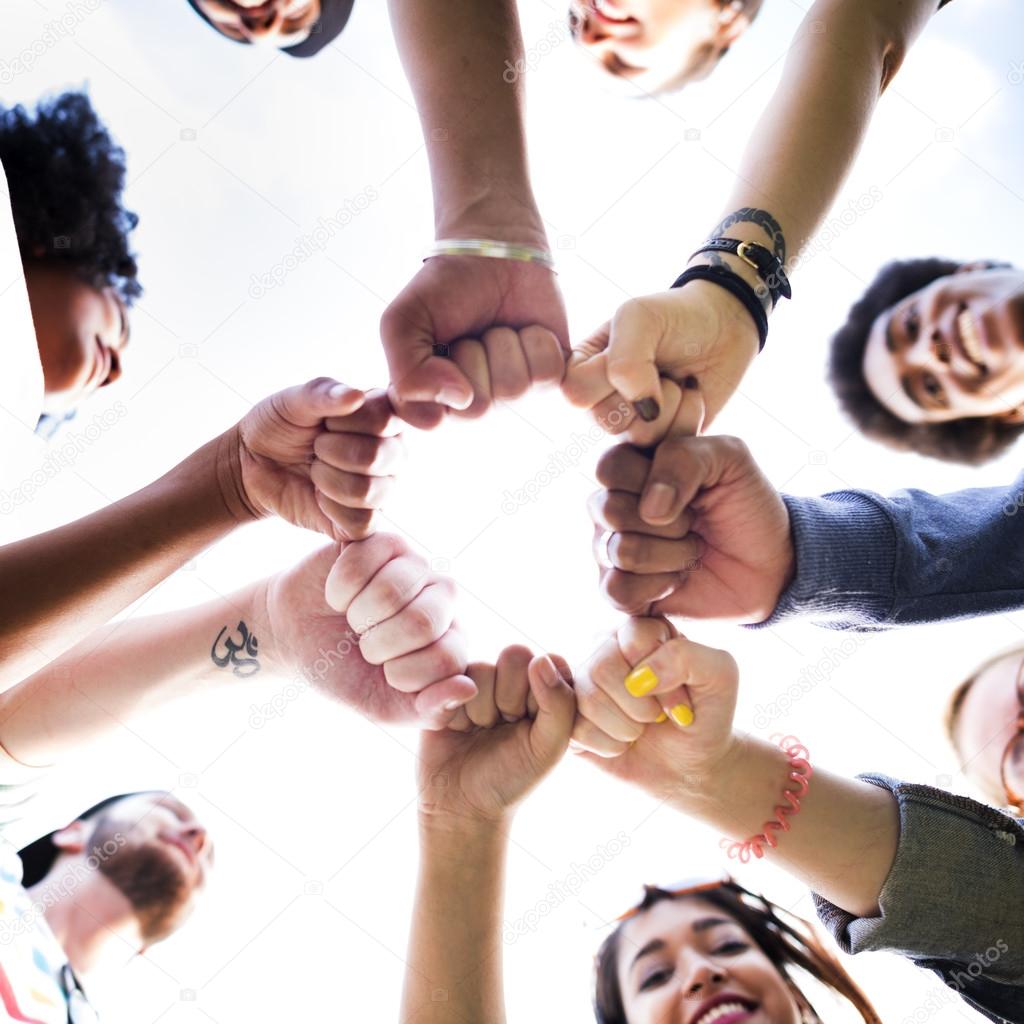 friends making fist bump gesture