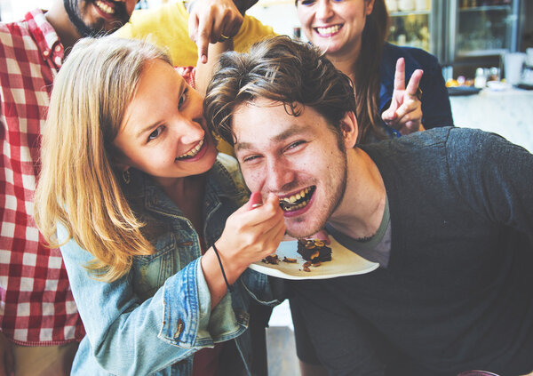 woman feeding her friend