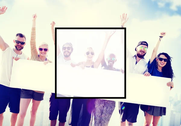 Friends holding big blank banner — Stock Photo, Image