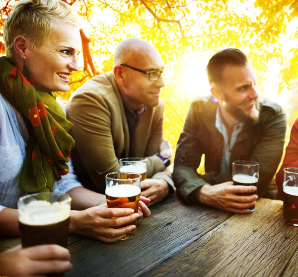 Friends hanging out at outdoors party — Stock Photo, Image