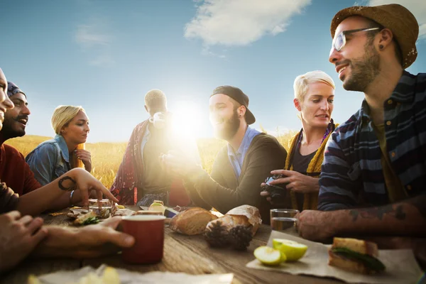 Friends hanging out at outdoors party — Stock Photo, Image