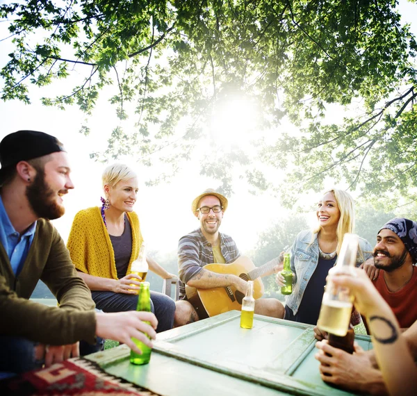 Diverse cheerful friends hanging out at outdoors party — Stock Photo, Image
