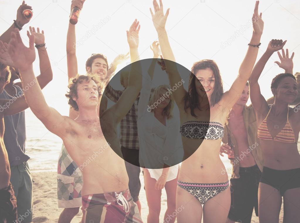 cheerful friends hanging out on the beach party