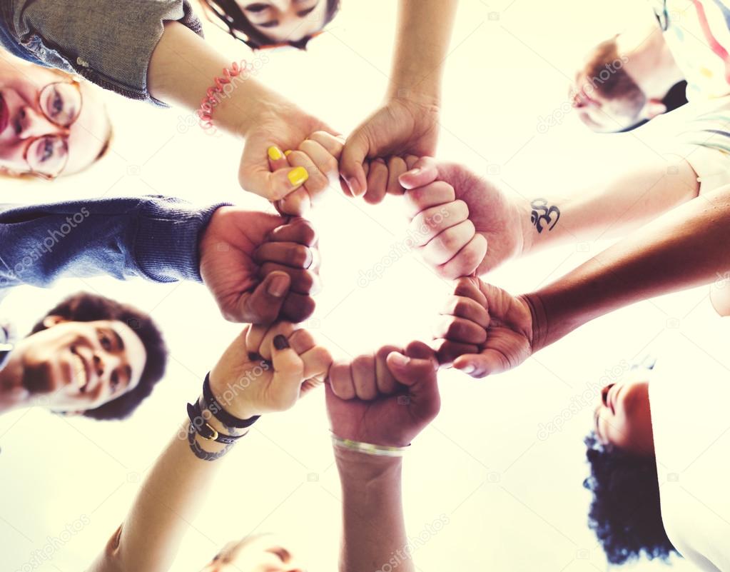 friends making fist bump gesture