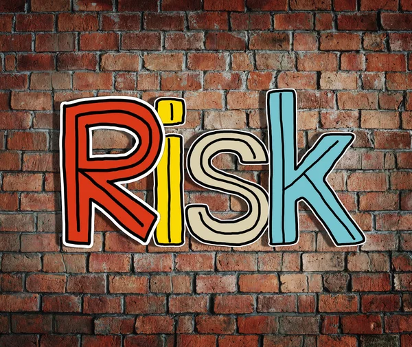 Slovo riziko na cihlovou zeď — Stock fotografie