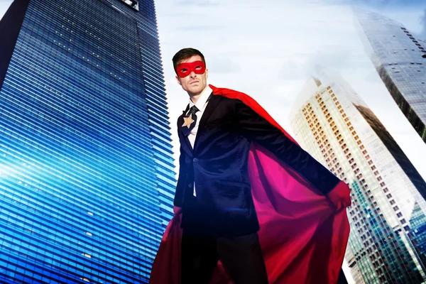 Superhero Businessman in modern city — Stock Photo, Image