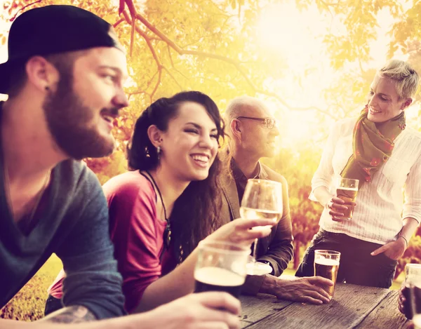 Friends hanging out at outdoors party — Stock Photo, Image