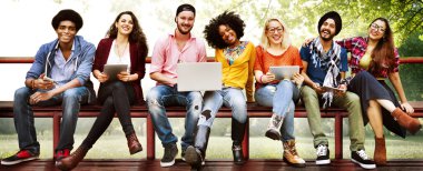 friends sitting on bench with laptop computers clipart