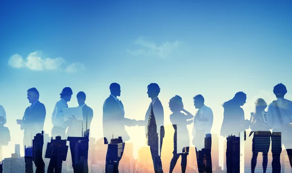 Silhouettes of business people — Stock Photo, Image