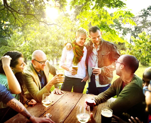 Friends hanging out at outdoors party — Stock Photo, Image