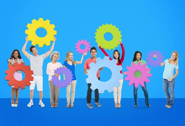 Diversity People holding Gears — Stock Photo, Image