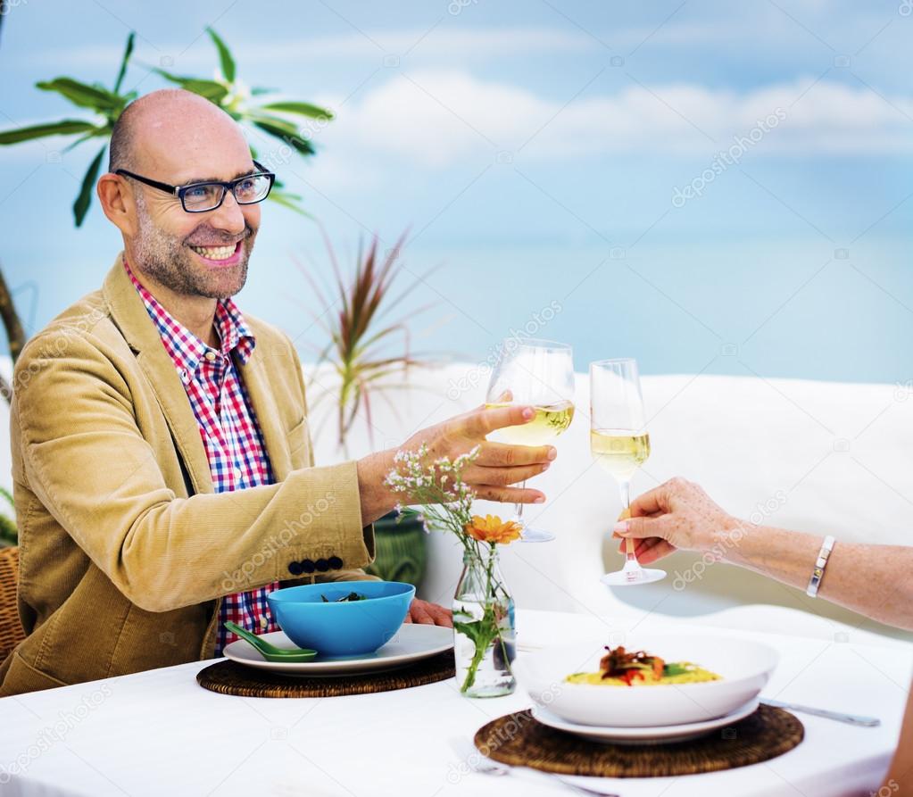 couple toasting with glasses of wine