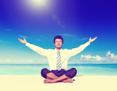 Businessman meditating on the beach Concept clipart