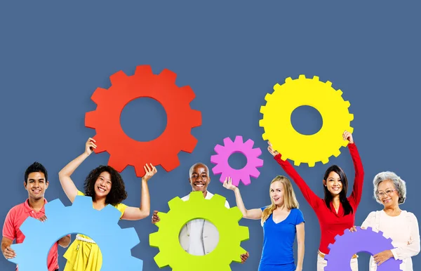 Diversity People holding Gears — Stock Photo, Image