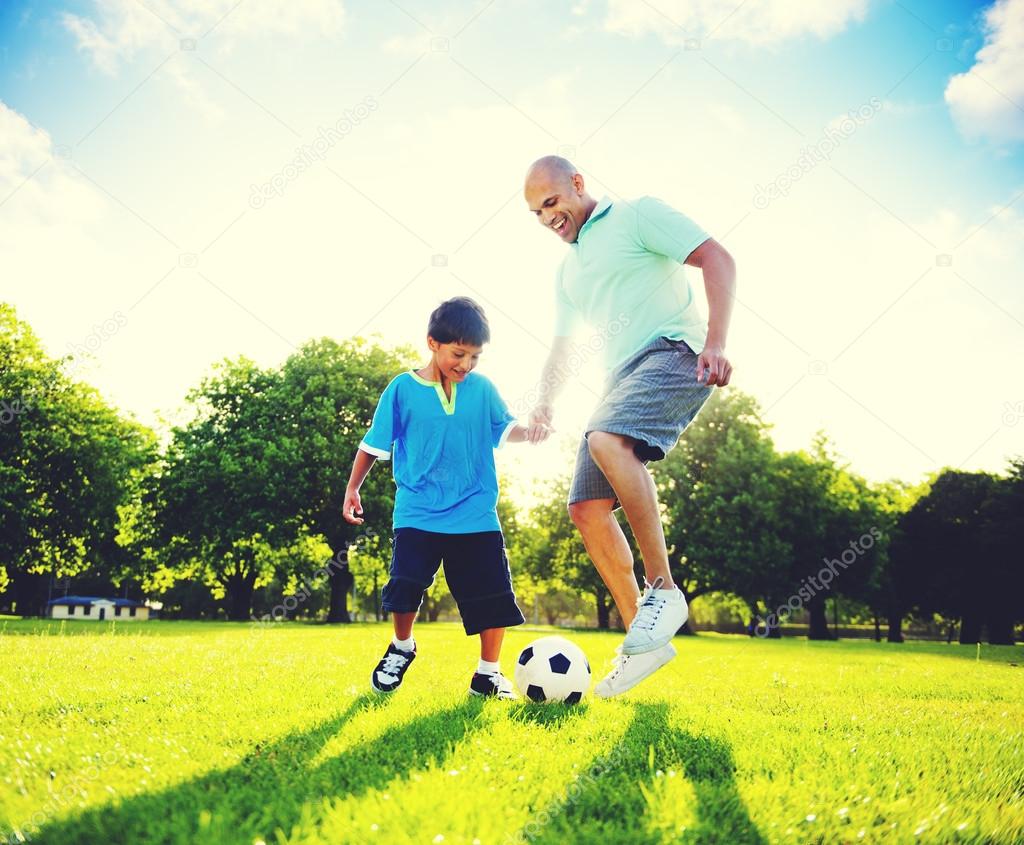 Father Son Playing Soccer Concept
