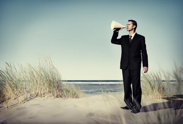 Business Man with loudspeaker on Beach Concept — Stock Photo, Image