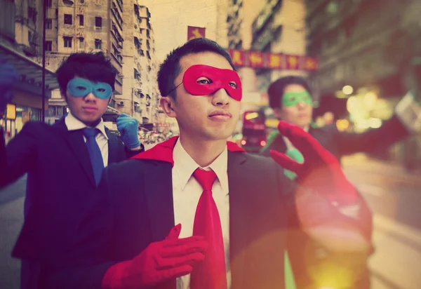 Businessmen in superhero masks — Stock Photo, Image