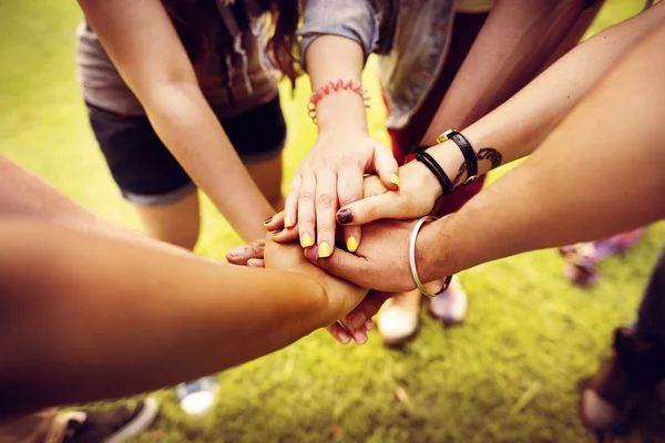 Young students making unity gesture — Stock Photo, Image