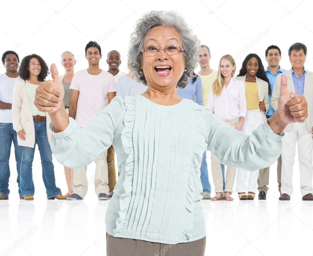 senior woman gesturing thumbs up sign