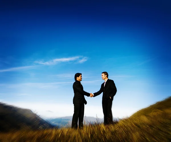 Businessmen Handshake at Mountains — Stock Photo, Image