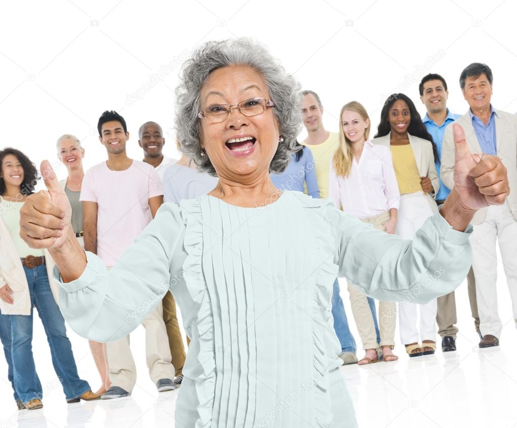 senior woman gesturing thumbs up sign