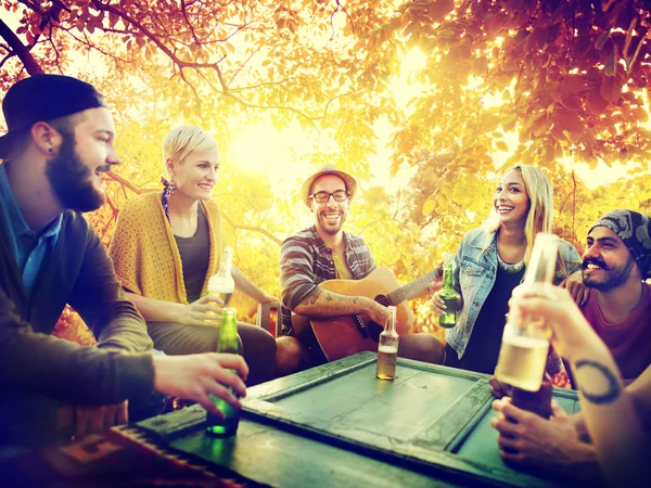 Friends hanging out at outdoors party — Stock Photo, Image